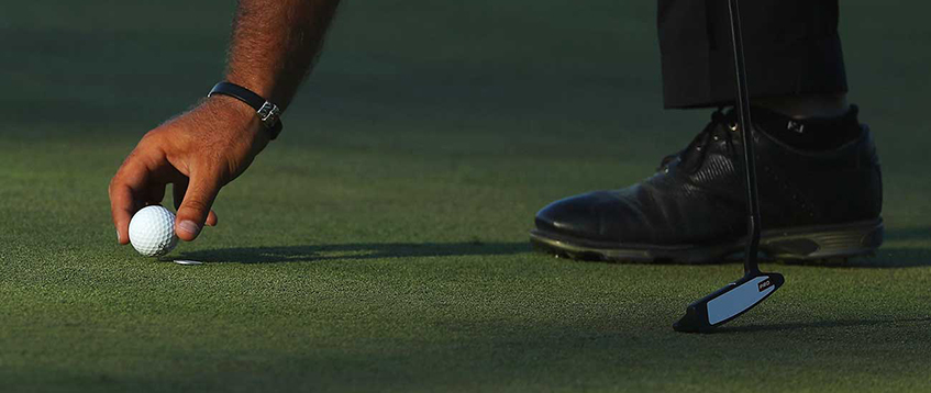 What is a Golf Ball Marker, image: golf.com